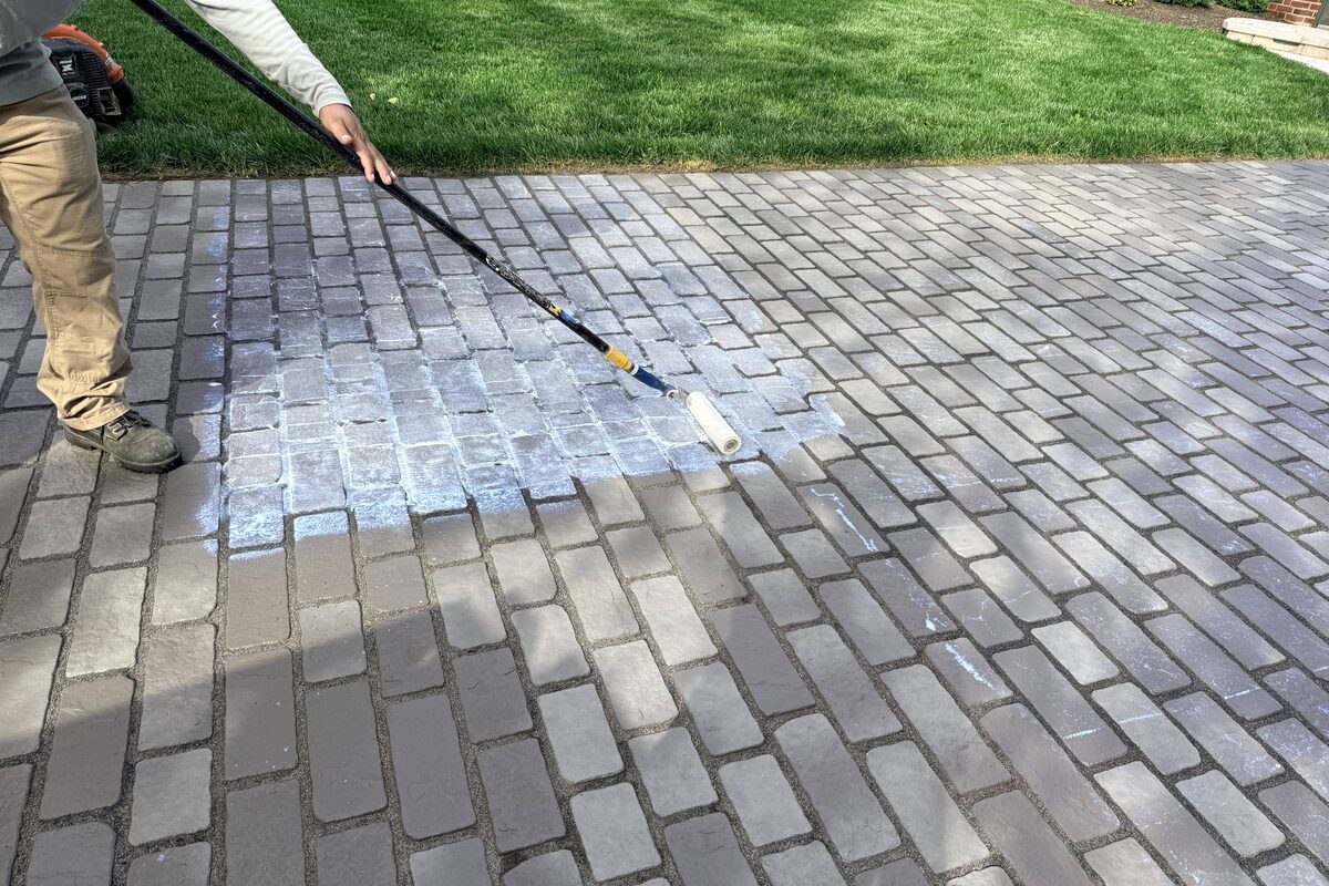 Sealer being applied to protect pavers and stabilize sand joints