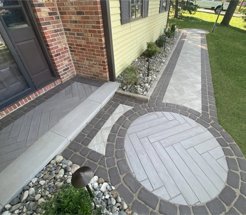 Finished paver walkway with circular inlay by Arborvine Landscaping